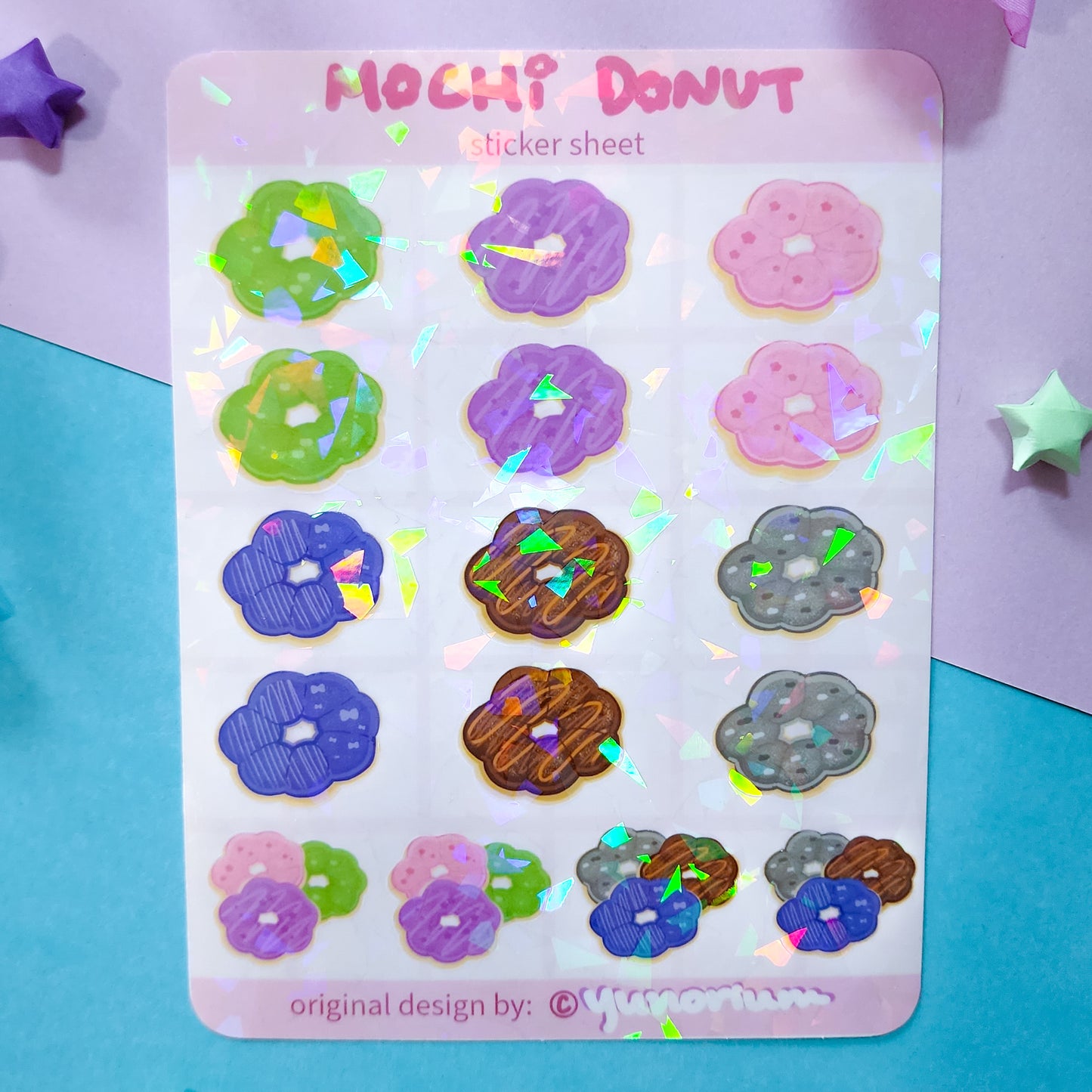 About 4 by 5 cracked ice holographic sticker sheet filled with mochi donuts by Yunorium